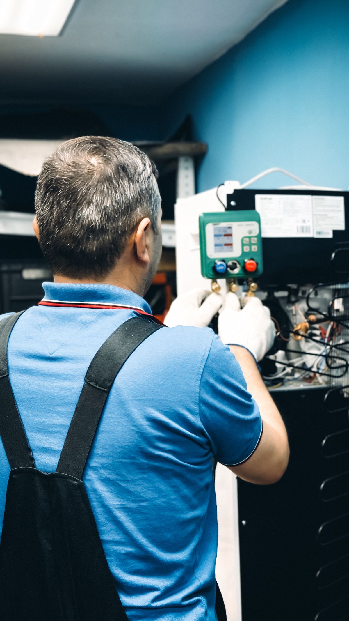 Technician inspecting commercial HVAC system in Las Vegas
